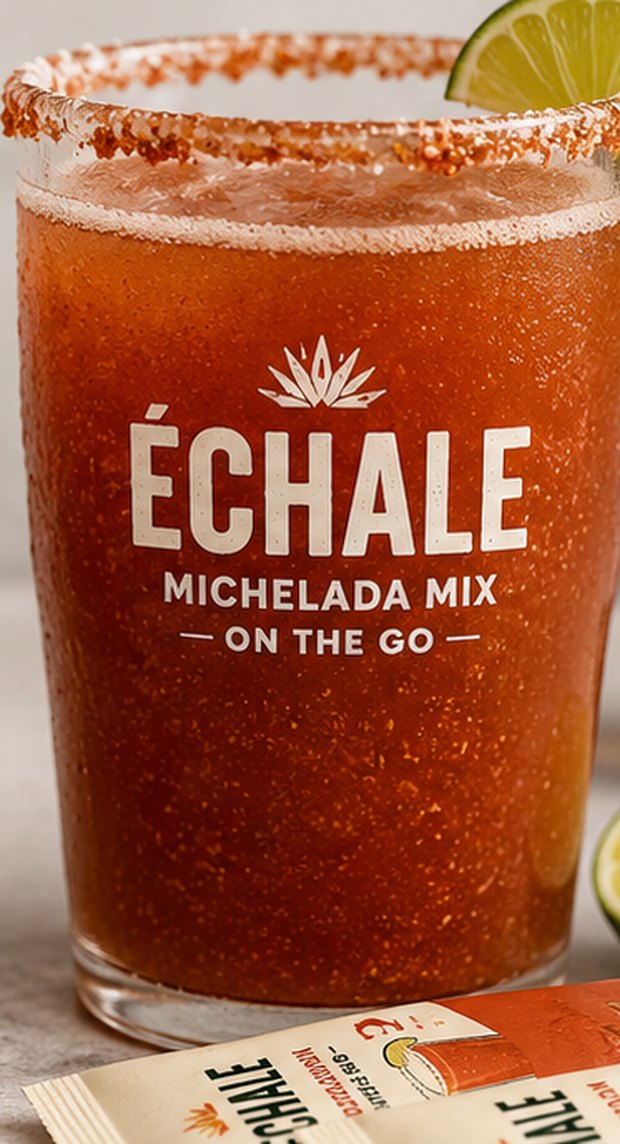 A finished michelada in a chile-rimmed glass with the ÉCHALE logo, made by pouring one ÉCHALE packet into beer.